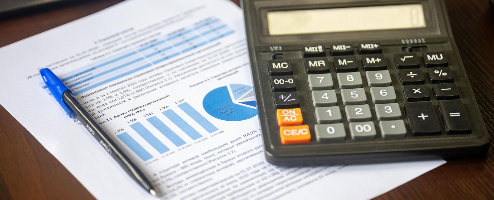 Calculator and financial reports on a desk