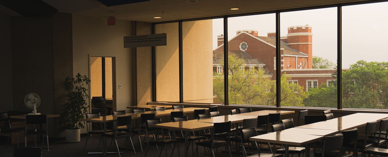 Quiet study hall with desks and large windows